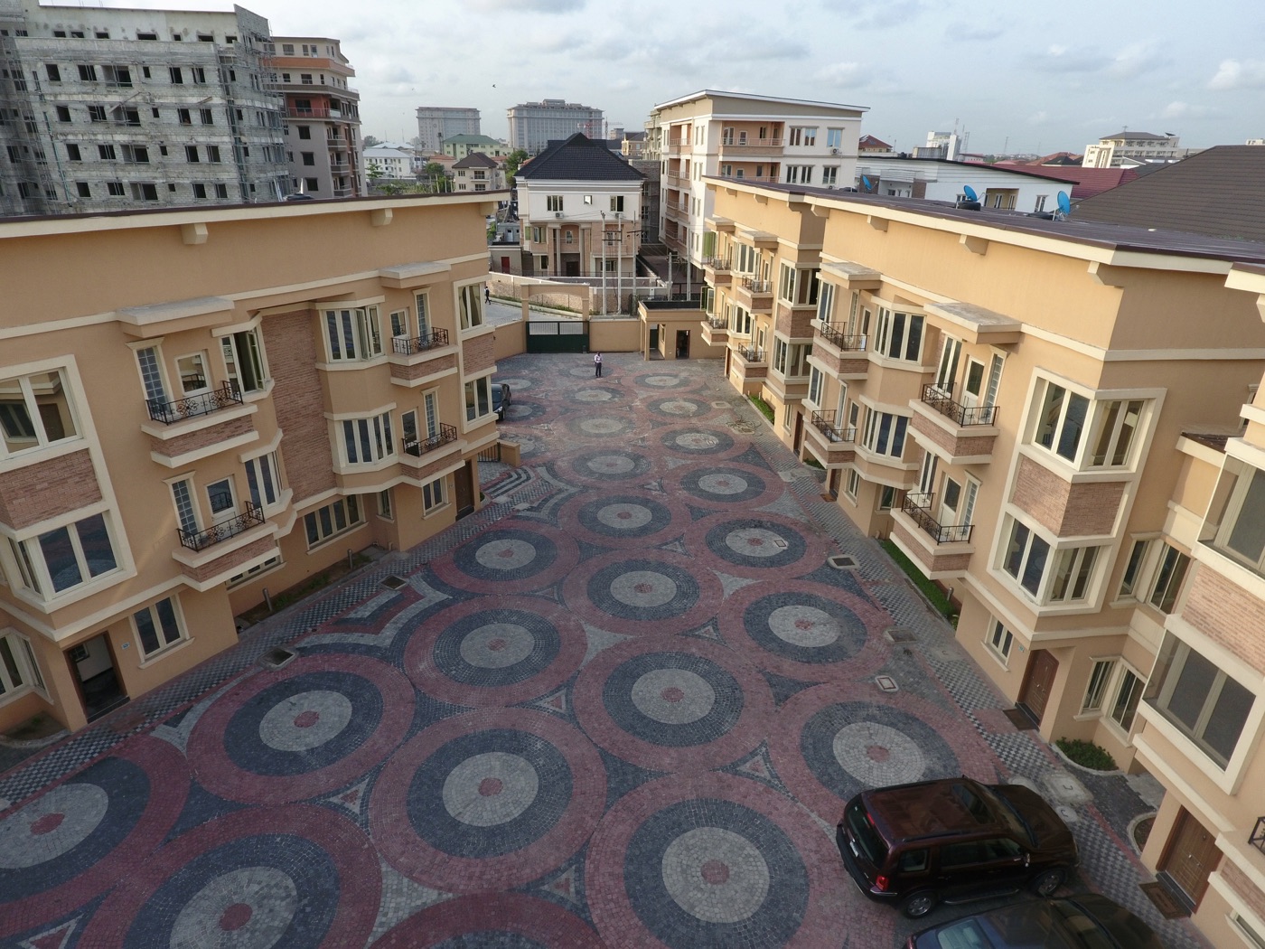 Sapphire Court homes surrounding a paved courtyard in Lagos